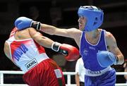 3 October 2011; John Joe Nevin, Cavan B.C., representing Ireland, right, exchanges punches with Akhil Kumar, India, during their 56kg bout. Nevin advanced to the Last 16 with a 21-14 victory. 2011 AIBA World Boxing Championships - Last 32, John Joe Nevin v Akhil Kumar. Heydar Aliyev Sports and Exhibition Complex, Baku, Azerbaijan. Picture credit: Stephen McCarthy / SPORTSFILE
