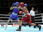 3 October 2011; John Joe Nevin, Cavan B.C., representing Ireland, left, exchanges punches with Akhil Kumar, India, during their 56kg bout. Nevin advanced to the Last 16 with a 21-14 victory. 2011 AIBA World Boxing Championships - Last 32, John Joe Nevin v Akhil Kumar. Heydar Aliyev Sports and Exhibition Complex, Baku, Azerbaijan. Picture credit: Stephen McCarthy / SPORTSFILE