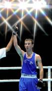 3 October 2011; John Joe Nevin, Cavan B.C., representing Ireland, is announced victorious over Akhil Kumar, India, during their 56kg bout. Nevin advanced to the Last 16 with a 21-14 victory. 2011 AIBA World Boxing Championships - Last 32, John Joe Nevin v Akhil Kumar. Heydar Aliyev Sports and Exhibition Complex, Baku, Azerbaijan. Picture credit: Stephen McCarthy / SPORTSFILE