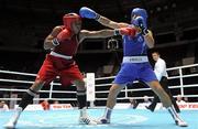3 October 2011; Ken Egan, Neilstown B.C., Dublin, representing Ireland, right, exchanges punches with Jose Larduet Gomez, Cuba, during their 91kg bout. Egan, making his international debut at the heavyweight division, retired during the third round with the score reading 30-12. 2011 AIBA World Boxing Championships - Last 32, Ken Egan v Jose Larduet Gomez. Heydar Aliyev Sports and Exhibition Complex, Baku, Azerbaijan. Picture credit: Stephen McCarthy / SPORTSFILE