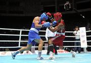 3 October 2011; Ken Egan, Neilstown B.C., Dublin, representing Ireland, left, exchanges punches with Jose Larduet Gomez, Cuba, during their 91kg bout. Egan, making his international debut at the heavyweight division, retired during the third round with the score reading 30-12. 2011 AIBA World Boxing Championships - Last 32, Ken Egan v Jose Larduet Gomez. Heydar Aliyev Sports and Exhibition Complex, Baku, Azerbaijan. Picture credit: Stephen McCarthy / SPORTSFILE