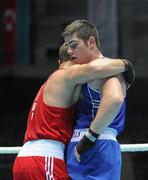 4 October 2011; Joe Ward, Moate B.C., Westmeath, representing Ireland, right, is consoled by Ehsan Rouzbahani, Iran, following their 81kg bout. Ward was defeated on countback after the bout ended 15-15. 2011 AIBA World Boxing Championships - Last 16, Joe Ward v Ehsan Rouzbahani. Heydar Aliyev Sports and Exhibition Complex, Baku, Azerbaijan. Picture credit: Stephen McCarthy / SPORTSFILE
