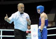4 October 2011; Referee Bahodir Jumaniyazov, Uzbekistan, issues a two-point penalty to Joe Ward, Moate B.C., Westmeath, representing Ireland, during his 81kg bout with Ehsan Rouzbahani, Iran. Ward was defeated on countback after the bout ended 15-15. 2011 AIBA World Boxing Championships - Last 16, Joe Ward v Ehsan Rouzbahani. Heydar Aliyev Sports and Exhibition Complex, Baku, Azerbaijan. Picture credit: Stephen McCarthy / SPORTSFILE