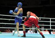 4 October 2011; Darren O'Neill, Paulstown B.C., Kilkenny, representing Ireland, left, exchanges punches with Mladen Manev, Bulgaria, during their 75kg bout. O'Neill's 19-12 victory ensured progression to the Quarter-Finals and also qualification for the London 2012 Olympic Games. 2011 AIBA World Boxing Championships - Last 16, Darren O'Neill v Mladen Manev. Heydar Aliyev Sports and Exhibition Complex, Baku, Azerbaijan. Picture credit: Stephen McCarthy / SPORTSFILE