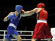 4 October 2011; Darren O'Neill, Paulstown B.C., Kilkenny, representing Ireland, left, exchanges punches with Mladen Manev, Bulgaria, during their 75kg bout. O'Neill's 19-12 victory ensured progression to the Quarter-Finals and also qualification for the London 2012 Olympic Games. 2011 AIBA World Boxing Championships - Last 16, Darren O'Neill v Mladen Manev. Heydar Aliyev Sports and Exhibition Complex, Baku, Azerbaijan. Picture credit: Stephen McCarthy / SPORTSFILE