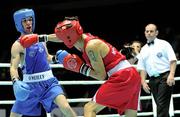 4 October 2011; John Joe Nevin, Cavan B.C., representing Ireland, left, exchanges punches with Otgondalai Dorjnyambuu, Mongolia, during their 56kg bout. Nevin won the contest on countback after the bout ended 18-18. Nevin's victory ensured progression to the Quarter-Finals and also qualification for the London 2012 Olympic Games. 2011 AIBA World Boxing Championships - Last 16, John Joe Nevinl v Otgondalai Dorjnyambuu. Heydar Aliyev Sports and Exhibition Complex, Baku, Azerbaijan. Picture credit: Stephen McCarthy / SPORTSFILE