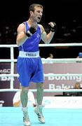 4 October 2011; John Joe Nevin, Cavan B.C., representing Ireland, celebrates victory over Otgondalai Dorjnyambuu, Mongolia, following their 56kg bout. Nevin won the contest on countback after the bout ended 18-18. Nevin's victory ensured progression to the Quarter-Finals and also qualification for the London 2012 Olympic Games. 2011 AIBA World Boxing Championships - Last 16, John Joe Nevin v Otgondalai Dorjnyambuu. Heydar Aliyev Sports and Exhibition Complex, Baku, Azerbaijan. Picture credit: Stephen McCarthy / SPORTSFILE