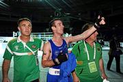 4 October 2011; John Joe Nevin, Cavan B.C., representing Ireland, celebrates victory over Otgondalai Dorjnyambuu, Mongolia, following their 56kg bout with coaches Billy Walsh, left, and Zaur Antia. Nevin won the contest on countback after the bout ended 18-18. Nevin's victory ensured progression to the Quarter-Finals and also qualification for the London 2012 Olympic Games. 2011 AIBA World Boxing Championships - Last 16, John Joe Nevin v Otgondalai Dorjnyambuu. Heydar Aliyev Sports and Exhibition Complex, Baku, Azerbaijan. Picture credit: Stephen McCarthy / SPORTSFILE