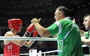 4 October 2011; Michael Conlan, St. John Bosco B.C., Belfast, Antrim, representing Ireland, following his 52kg bout victory over Nordine Oubaali, France, with coaches Billy Walsh and Zaur Antia, right. Conlan won the contest 20-17 and ensured progression to the Quarter-Finals and also qualification for the London 2012 Olympic Games. 2011 AIBA World Boxing Championships - Last 16, Michael Conlan v Nordine Oubaali. Heydar Aliyev Sports and Exhibition Complex, Baku, Azerbaijan. Picture credit: Stephen McCarthy / SPORTSFILE