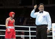 4 October 2011; David Oliver Joyce, St Michael's Athy B.C., Kildare, representing Ireland, receives a two-point penalty from referee Jones Kennedy Silva, Brazil, with four seconds remaining in his 60kg bout with Jai Bhagwan, India. Joyce was defeated 32-30. 2011 AIBA World Boxing Championships - Last 16, David Oliver Joyce v Jai Bhagwan. Heydar Aliyev Sports and Exhibition Complex, Baku, Azerbaijan. Picture credit: Stephen McCarthy / SPORTSFILE
