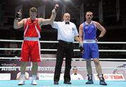 4 October 2011; Referee Tony Germaine, Canada, raises the hand of Roberto Cammerelle, Italy, following his 91+kg bout victory over Con Sheehan, Clonmel B.C., Tipperary, representing Ireland. Sheehan retired during the third round after visiting the medic twice. 2011 AIBA World Boxing Championships - Last 16, Con Sheehan v Roberto Cammerelle. Heydar Aliyev Sports and Exhibition Complex, Baku, Azerbaijan. Picture credit: Stephen McCarthy / SPORTSFILE