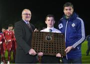 13 April 2017; Northern Ireland captain Bobby Burns is presented with the Centenary Shield by Cledwyn Ashford, left, and Simon Nicks, from the Northern Ireland FA, after the Centenary Shield match between Republic of Ireland U18s and England at Home Farm FC in Whitehall, Dublin. Photo by Matt Browne/Sportsfile