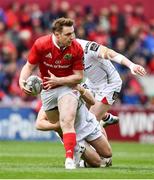 15 April 2017; Rory Scannell of Munster is tackled by Paddy Jackson of Ulster during the Guinness PRO12 match between Munster and Ulster at Thomond Park in Limerick. Photo by Ramsey Cardy/Sportsfile