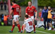 15 April 2017; Paddy Jackson of Ulster is helped to his feet by Keith Earls of Munster during the Guinness PRO12 match between Munster and Ulster at Thomond Park in Limerick. Photo by Ramsey Cardy/Sportsfile