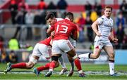 15 April 2017; Jacob Stockdale of Ulster is tackled by Tommy O’Donnell, left, and Francis Saili of Munster during the Guinness PRO12 match between Munster and Ulster at Thomond Park in Limerick. Photo by Ramsey Cardy/Sportsfile