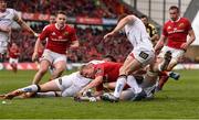 15 April 2017; Keith Earls of Munster scores his side's second try despite the efforts of Jacob Stockdale and Clive Ross of Ulster during the Guinness PRO12 Round 20 match between Munster and Ulster at Thomond Park in Limeric Photo by Diarmuid Greene/Sportsfile
