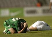 7 October 2006; Robbie Keane, Republic of Ireland, holds his head after a clash of heads. Euro 2008 Championship Qualifier, Cyprus v Republic of Ireland, GSP Stadium, Nicosia, Cyprus. Picture credit: Brian Lawless / SPORTSFILE