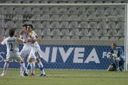 7 October 2006; Konstantiuus Charalampidis, Cyprus, celebrates his side's fourth goal with team-mate Konstantinos Makridis, 20, and Theodotou as a dejected Republic of Ireland goalkeeper Paddy Kenny looks on. Euro 2008 Championship Qualifier, Cyprus v Republic of Ireland, GSP Stadium, Nicosia, Cyprus. Picture credit: David Maher / SPORTSFILE