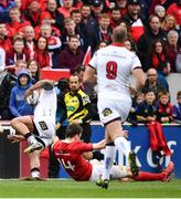 15 April 2017; Charles Piutau of Ulster is tackled by Darren Sweetnam of Munster, which resulted in Sweetnam going off injured, during the Guinness PRO12 match between Munster and Ulster at Thomond Park in Limerick. Photo by Ramsey Cardy/Sportsfile