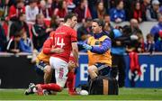 15 April 2017; Darren Sweetnam of Munster is treated for an injury during the Guinness PRO12 match between Munster and Ulster at Thomond Park in Limerick. Photo by Ramsey Cardy/Sportsfile