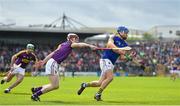 16 April 2017; John McGrath of Tipperary is tackled by James Breen of Wexford during the Allianz Hurling League Division 1 Semi-Final match between Wexford and Tipperary at Nowlan Park in Kilkenny. Photo by Ramsey Cardy/Sportsfile