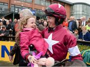 16 April 2017; Jockey Bryan Cooper with Tiana O'Leary, age 8, daughter of winning owner Michael O'Leary, after winning the Ryanair Gold Cup Novice Steeplechase during the Fairyhouse Easter Festival at Fairyhouse Racecourse in Ratoath, Co Meath. Photo by Seb Daly/Sportsfile