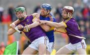 16 April 2017; Jason Forde of Tipperary is tackled by Aidan Nolan, left, and James Breen of Wexford during the Allianz Hurling League Division 1 Semi-Final match between Wexford and Tipperary at Nowlan Park in Kilkenny. Photo by Ramsey Cardy/Sportsfile