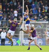 16 April 2017; John McGrath of Tipperary in action against Matthew O'Hanlon, left, and Liam Ryan of Wexford during the Allianz Hurling League Division 1 Semi-Final match between Wexford and Tipperary at Nowlan Park in Kilkenny. Photo by Ramsey Cardy/Sportsfile