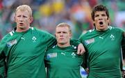 25 September 2011; Ireland locks Leo Cullen, left, and Donncha O'Callaghan stand with team-mate Keith Earls, centre, during the national anthems before the game. 2011 Rugby World Cup, Pool C, Ireland v Russia, Rotorua International Stadium, Rotorua, New Zealand. Picture credit: Brendan Moran / SPORTSFILE