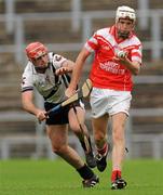 9 October 2011; James Campbell, Loughgiel Shamrocks, in action against Mark Craig, Dungiven Kevin Lynchs. AIB GAA Hurling Ulster Senior Club Championship Semi-Final, Loughgiel v  Dungiven Kevin Lynchs, Casement Park, Belfast, Co. Antrim. Picture credit: Oliver McVeigh / SPORTSFILE