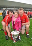 9 October 2011; Edenderry players Richie Dalton, left, and Sean Pender, celebrate after victory over Clara with Tara McDermott, aged 8, from Edenderry. Tullamore Court Hotel Senior Football Final, Clara v Edenderry, O'Connor Park, Tullamore, Co. Offaly. Picture credit: Diarmuid Greene / SPORTSFILE