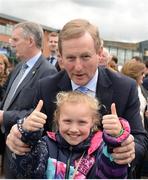 17 April 2017; An Taoiseach Enda Kenny T.D. with Naomi Denton, age 9, from Killinick, Co. Wexford, in attendance prior to the Avoca Dunboyne Juvenile Hurdle during the Fairyhouse Easter Festival at Fairyhouse Racecourse in Ratoath, Co Meath. Photo by Seb Daly/Sportsfile