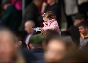 17 April 2017; Ella Fitzgerald, age 2, studies the form prior to Fairyhouse Steel Handicap Hurdle during the Fairyhouse Easter Festival at Fairyhouse Racecourse in Ratoath, Co Meath. Photo by Seb Daly/Sportsfile