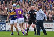 16 April 2017; Wexford manager Davy Fitzgerald and Aidan Nolan, 8, tussle with Jason Forde of Tipperary during the Allianz Hurling League Division 1 Semi-Final match between Wexford and Tipperary at Nowlan Park in Kilkenny. Photo by Ramsey Cardy/Sportsfile