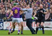 16 April 2017; Wexford manager Davy Fitzgerald and Aidan Nolan, 8, tussle with Jason Forde of Tipperary during the Allianz Hurling League Division 1 Semi-Final match between Wexford and Tipperary at Nowlan Park in Kilkenny. Photo by Ramsey Cardy/Sportsfile