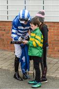 18 April 2017; Jockey Harley Dunne signs an autograph for Ulick McDonnell, age 7, from Dunboyne, Co Meath, during the Fairyhouse Easter Festival at Fairyhouse Racecourse in Ratoath, Co Meath. Photo by Cody Glenn/Sportsfile