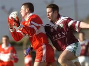 22 February 2004; Ronan Rocks, Loup, in action against Kevin Gavin, Caltra. AIB All-Ireland Club Football Semi-Final, Caltra v Loup, Markievicz Park, Sligo. Picture credit; Damien Eagers / SPORTSFILE