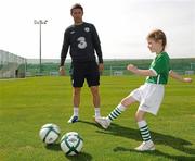 31 August 2010; Alex Howard, age 7, from Ashbourne, Co. Meath, shows off her skills to Republic of Ireland captain Robbie Keane at the announcement today by 3, Ireland’s largest high speed network, and the Football Association of Ireland of an exciting opportunity for one lucky young football fan to be the next mascot when the senior National team play Andorra in the Aviva Stadium on September 7th 2010. The winner will have the chance of a lifetime to lead the team onto the pitch with the captain, Robbie Keane. All entrants must be 7-11 years old. To nominate a mascot, visit www.three.ie and submit 50 words on why your nominated child would make a great mascot for the Irish National football team. The winner will be announced after the team training session on Monday 6th September and the prize will also include overnight accommodation and a new 3Pay phone from 3 for the nominator. Gannon Park, Malahide, Co. Dublin. Picture credit: David Maher / SPORTSFILE