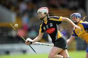 9 July 2011; Edel Maher of Kilkenny in action against Chloe Morey of Clare during the All Ireland Senior Camogie Championship in association with RTE Sport match between Kilkenny and Clare at Nowlan Park in Kilkenny. Photo by Matt Browne/Sportsfile