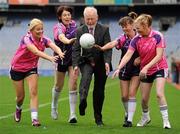 10 October 2011; Mental Health Ireland CEO, Brian Howard is tackled by, from left, Judith Rogan, Naomh Mearnog, Geraldine Burke, Kilmacud Crokes, Sinead Hamill, Kilmacud Crokes, and Siobhan McCarthy, Naomh Mearnog, at the launch of Ladies Gaelic Football Association and Mental Health Ireland’s partnership which aims to increase the awareness of mental health issues in Ireland through their Gaelic4Mothers and Building Resilience Together initiatives. Croke Park, Dublin. Picture credit: Pat Murphy / SPORTSFILE