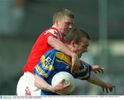 5 May 2002; Patrick Cullen Longford, in action against Louth's Donagh Callan. Bank of Ireland Leinster Senior Football Championship First Round. Louth v Longford. Pairc Tailteann, Navan Co. Meath. Picture credit; David Maher / SPORTSFILE