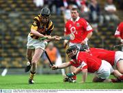 5 May 2002; Martin Comerford, Kilkenny, scores his sides first goal despite the attentions of Wayne Sherlock, Cork. Kilkenny v Cork, Allianz National hurling League Final Division 1, Semple Stadium, Thurles, Co. Tipperary. Picture credit; Pat Murphy / SPORTSFILE