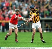 5 May 2002; Brian Dowling, Kilkenny, scores his sides winning point despite the attentions of Wayne Sherlock, Cork. Kilkenny v Cork, Allianz National hurling League Final Division 1, Semple Stadium, Thurles, Co. Tipperary. Picture credit; Damien Eagers / SPORTSFILE