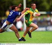 12 May 2002; Brendan Devenney, Donegal, in action against Cathal Collins, Cavan. Cavan v Donegal, Ulster Senior Football Championship, Breffni Park, Co. Cavan. Picture credit; Ray McManus / SPORTSFILE