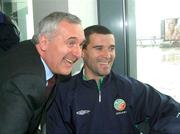 17 May 2002; An Taoiseach Bertie Ahern TD, meets Republic of Ireland captain Roy Keane pose for a photograph for Jason McAteer at Dublin Airport prior to the team's departure to their base on Saipan island in preparation tor the World Cup 2002 in Japan and Korea. Soccer. Picture credit; David Maher / SPORTSFILE *EDI*