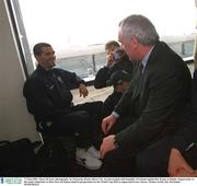 17 May 2002; Jason McAteer photographs An Taoiseach, Bertie Ahern T.D., in conversation with Republic of Ireland captain Roy Keane at Dublin Airport prior to the team's departure to their base on Saipan island in preparation tor the World Cup 2002 in Japan and Korea. Soccer. Picture credit; Ray McManus / SPORTSFILE
