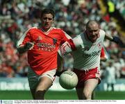 19 May 2002; Tony McEntee, Armagh, in action against Tyrone's Chris Lawn. Tyrone v Armagh, Ulster Senior Football Championship, St. Tierneach's Park, Clones, Monaghan. Picture credit; Pat Murphy / SPORTSFILE SPORTSFILE