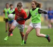 21 April 2017; Ronan O'Rourke, representing Cornafean GAA Club, Co Cavan, in action against Sophie Daly, representing St Finbar's GAA Club, Co Cavan, during the Go Games Provincial Days in partnership with Littlewoods Ireland Day 7 at Croke Park in Dublin. Photo by Cody Glenn/Sportsfile