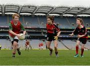 21 April 2017; Fionn McBarron, representing Lisnaskea GAA Club, Co Fermanagh, in action against Niamh Mulligan, representing Brookeborough GAA Club, Co Fermanagh, during the Go Games Provincial Days in partnership with Littlewoods Ireland Day 7 at Croke Park in Dublin. Photo by Cody Glenn/Sportsfile