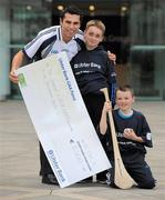 12 October 2011; Pictured at Ulster Bank Headquarters in Dublin is, Sean Og O hAilpin, Ulster Bank Gaa Force Ambassador with St Joseph O'Connell Boys GAA Club members Dillon McCarthy, age 10, from Crinan Strand, and Josh Doran, age 10, from East Wall, right. St Joseph O'Connell Boys GAA Club in Dublin received a major boost as Ulster Bank announced the winners of ‘Ulster Bank GAA Force’ – a major club focused initiative supporting local GAA clubs by giving them the opportunity to refurbish and upgrade their facilities. Ulster Bank GAA Force was introduced this summer to coincide with Ulster Bank’s sponsorship of the GAA Football All-Ireland Championships. St Joseph O'Connell Boys GAA Club was awarded a support package worth €5,000 as one of four provincial runners-up in the Ulster Bank GAA Force initiative. Ulster Bank, George’s Quay, Dublin. Picture credit: Brian Lawless / SPORTSFILE